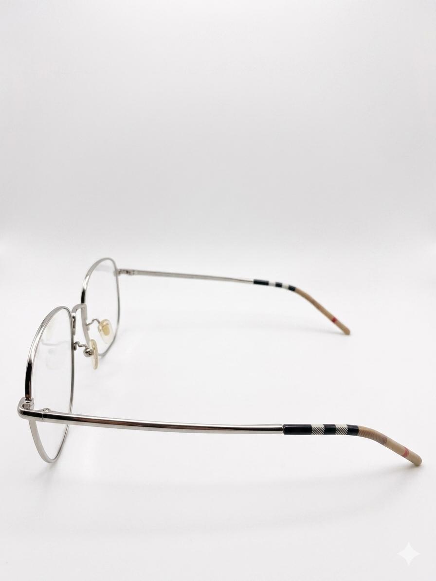 Lentes Ópticos Metálicos Burberry – Estilo Ovalado con Detalle de Icon Stripe