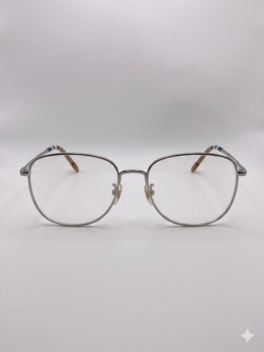 Lentes Ópticos Metálicos Burberry – Estilo Ovalado con Detalle de Icon Stripe