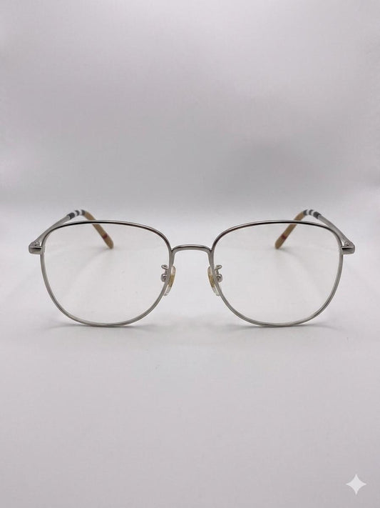 Lentes Ópticos Metálicos Burberry – Estilo Ovalado con Detalle de Icon Stripe