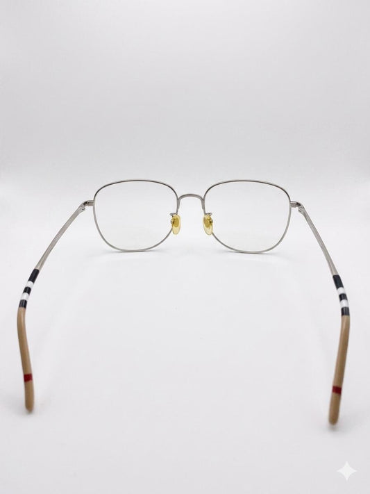 Lentes Ópticos Metálicos Burberry – Estilo Ovalado con Detalle de Icon Stripe
