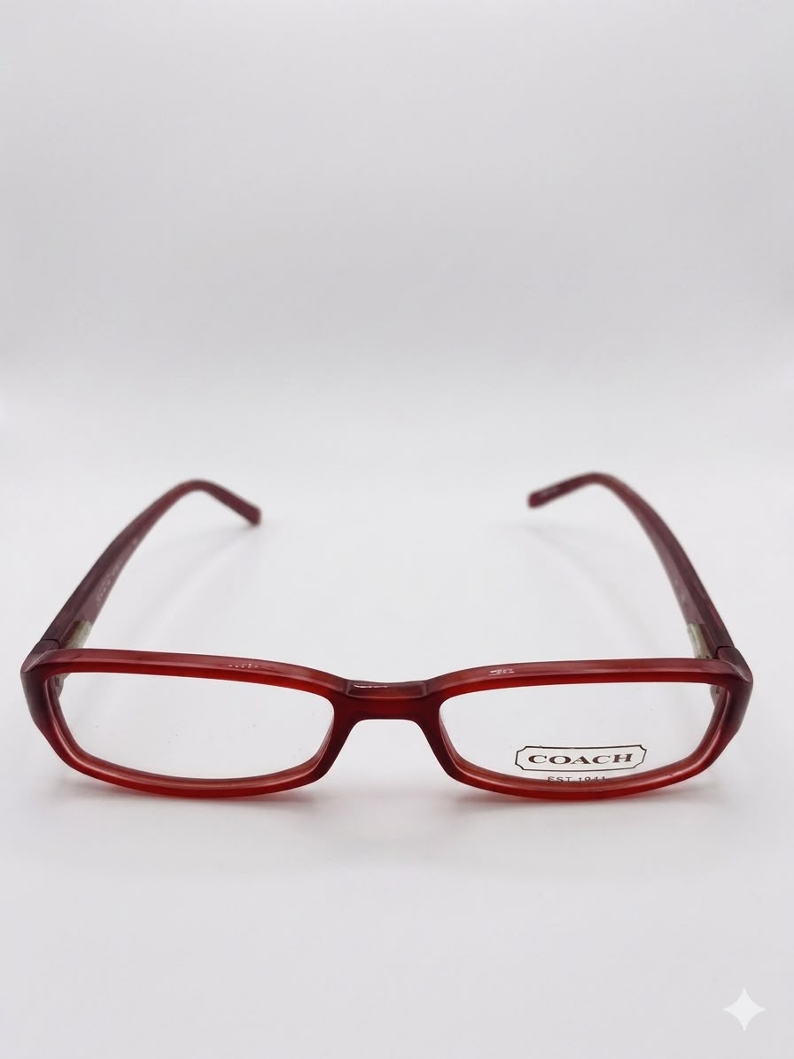 Anteojos Coach de marco color rojo.