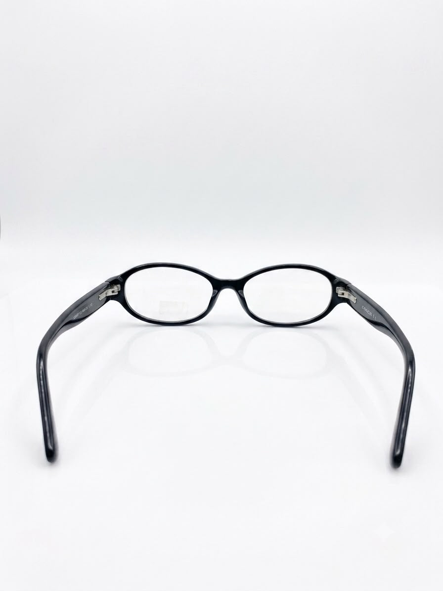Lentes Ópticos Coach - Negros con Patillas Estampadas
